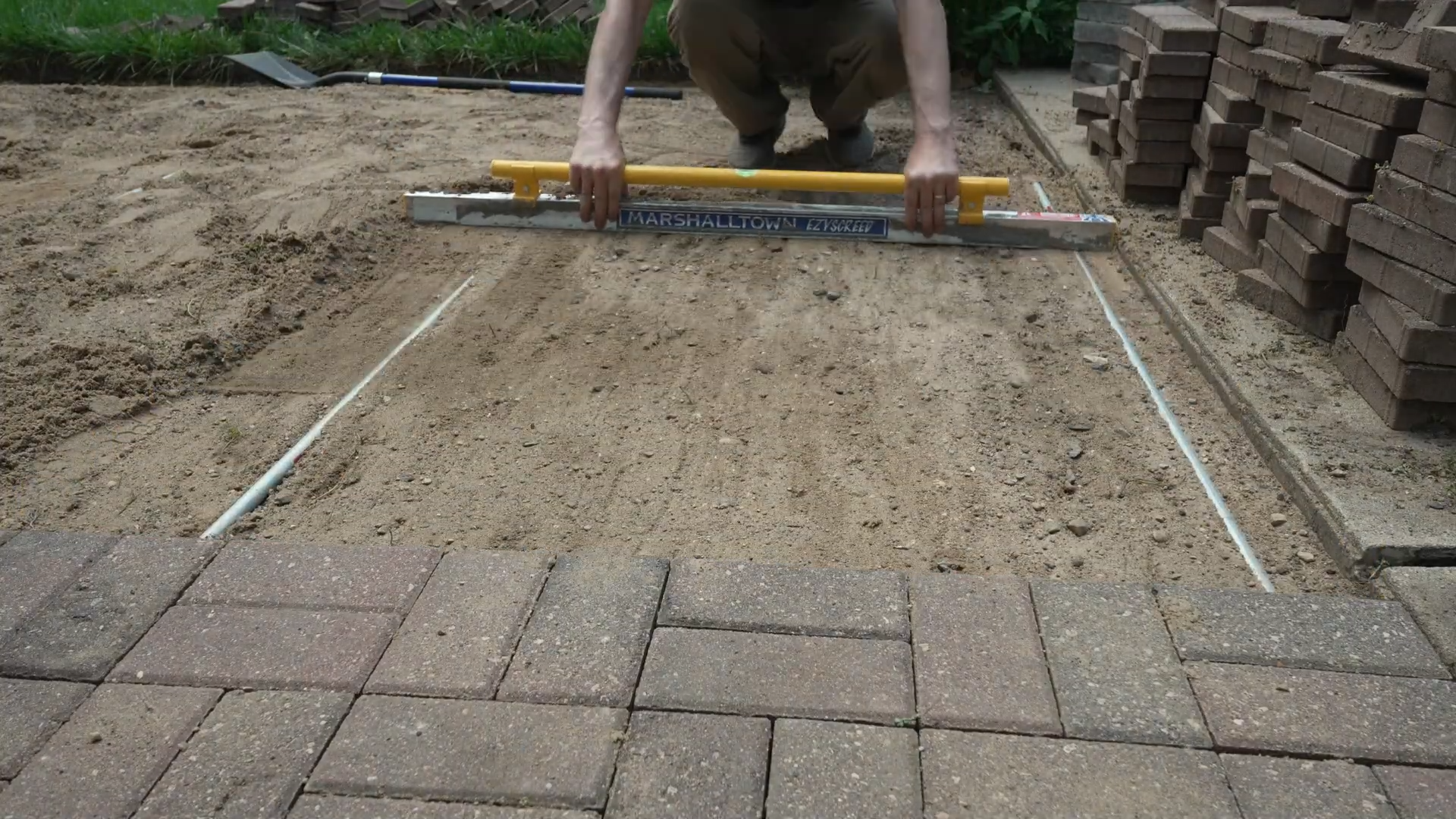 screed guides in the sand